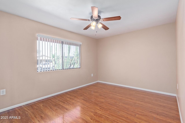 unfurnished room featuring hardwood / wood-style flooring and ceiling fan