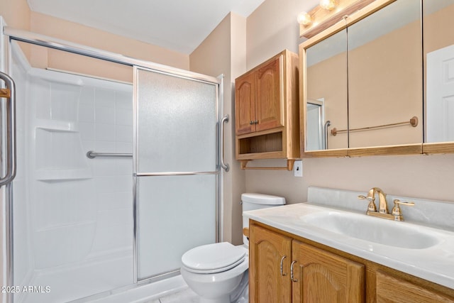 bathroom featuring walk in shower, vanity, and toilet