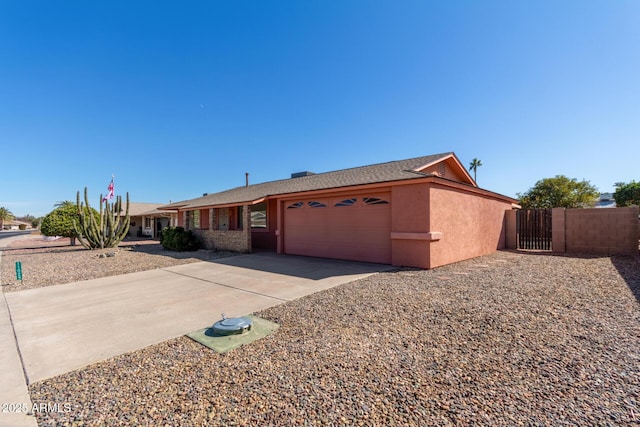 ranch-style house featuring a garage