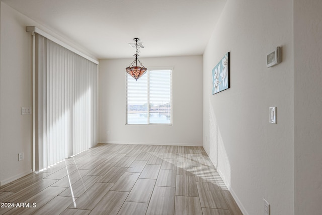 empty room with light hardwood / wood-style floors