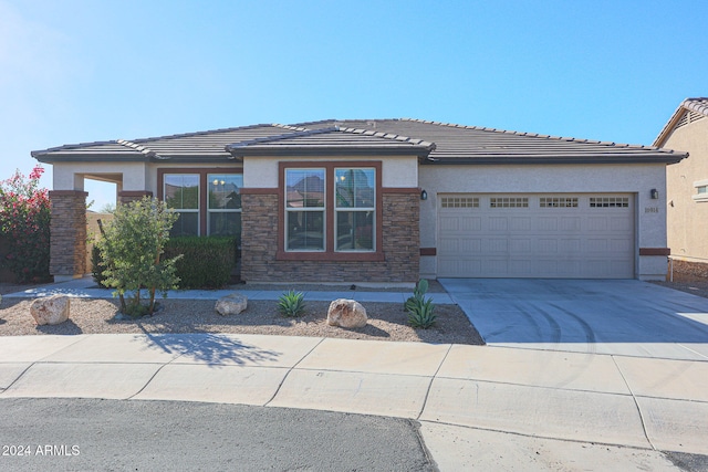 prairie-style house featuring a garage