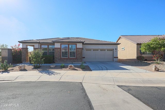 prairie-style house featuring a garage