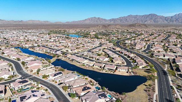 drone / aerial view with a water and mountain view