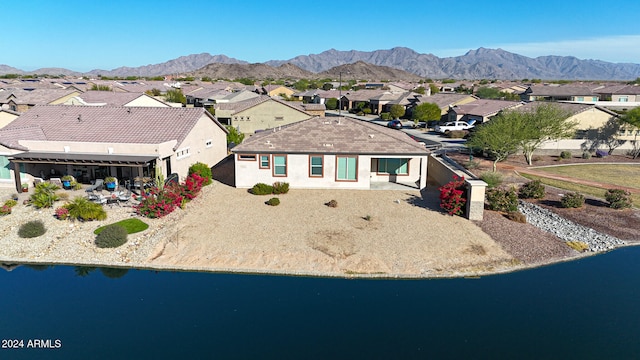 exterior space featuring a water and mountain view