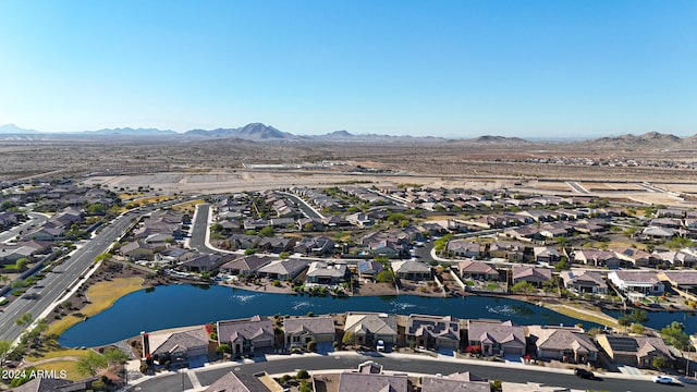 birds eye view of property with a water and mountain view