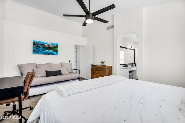 1320 E Scott Ave, Gilbert, AZ 85234 - bedroom with arched walkways, a high ceiling, ensuite bath, carpet flooring, and a ceiling fan