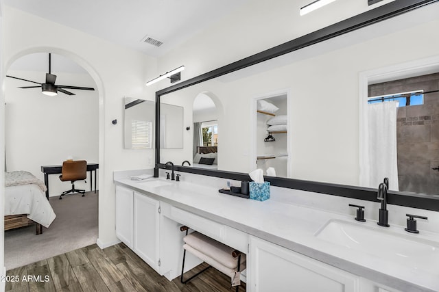 1320 E Scott Ave, Gilbert, AZ 85234 - full bath with connected bathroom, double vanity, wood finished floors, a ceiling fan, and a shower with shower curtain