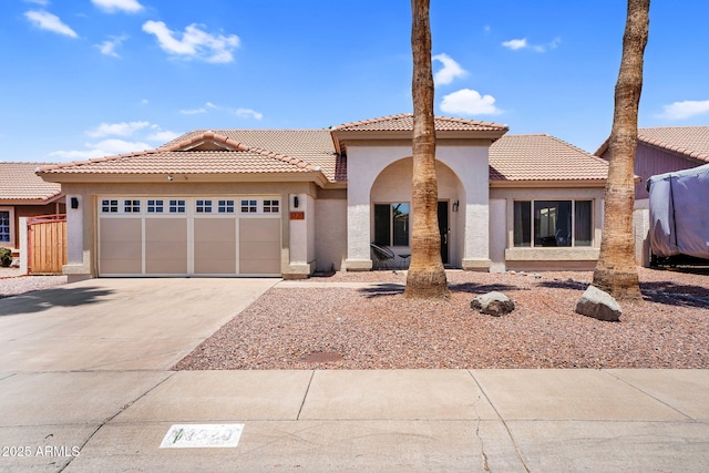 1320 E Scott Ave, Gilbert, AZ 85234 - mediterranean / spanish house with stucco siding, a garage, driveway, and a tiled roof