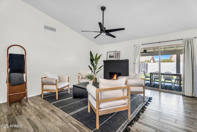 1320 E Scott Ave, Gilbert, AZ 85234 - living room featuring lofted ceiling, a ceiling fan, wood finished floors, and a fireplace