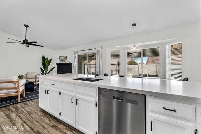 1320 E Scott Ave, Gilbert, AZ 85234 - kitchen featuring dishwasher, light countertops, hanging light fixtures, a ceiling fan, and a sink