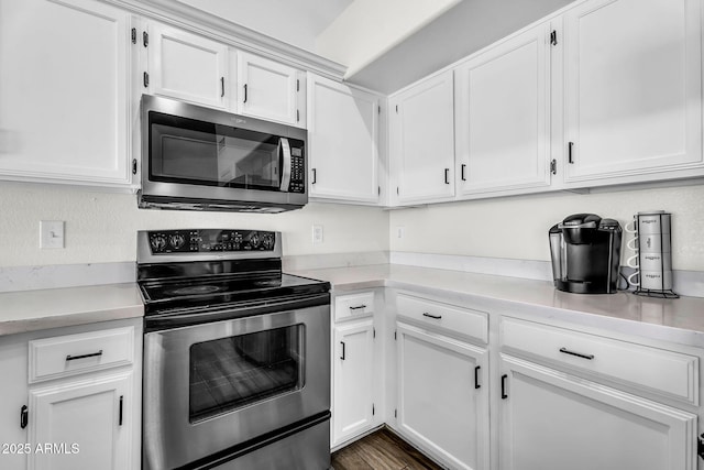 1320 E Scott Ave, Gilbert, AZ 85234 - kitchen with stainless steel appliances, white cabinets, light countertops, and dark wood-style floors