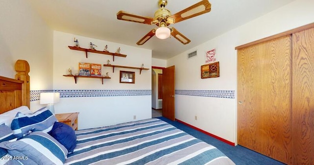 bedroom featuring visible vents, carpet floors, baseboards, and ceiling fan