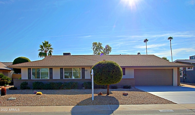 ranch-style house featuring a garage