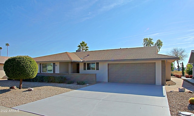 single story home featuring a garage