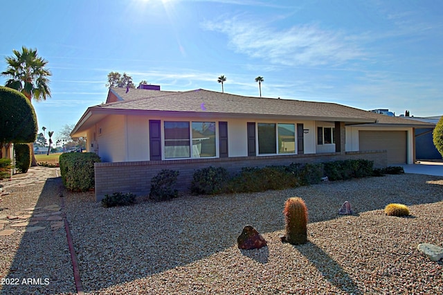 ranch-style home featuring a garage