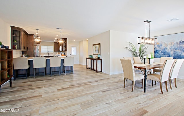 dining room with light wood-type flooring