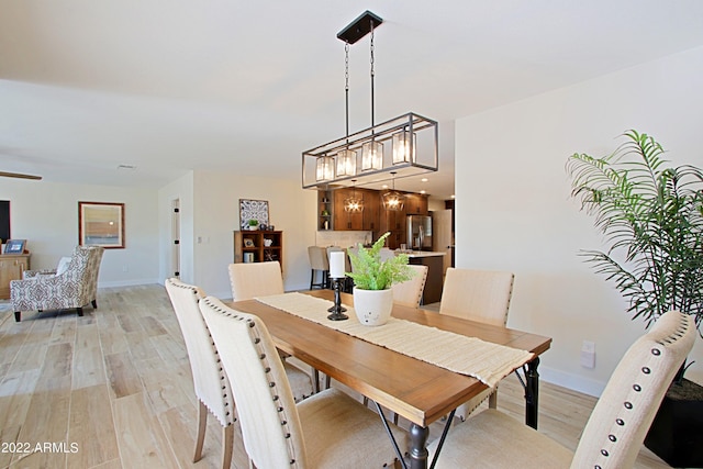 dining area with light wood-type flooring