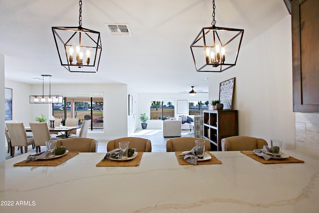 dining area with ceiling fan and plenty of natural light