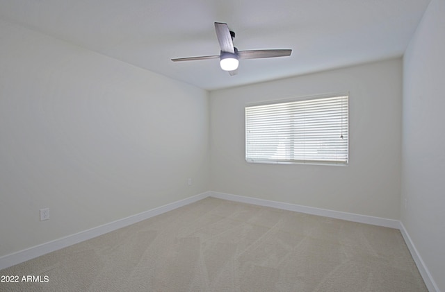 empty room with light carpet and ceiling fan