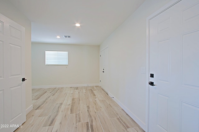 hallway with light wood-type flooring