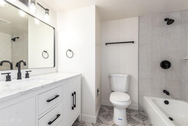 full bathroom with toilet, vanity, and tiled shower / bath combo