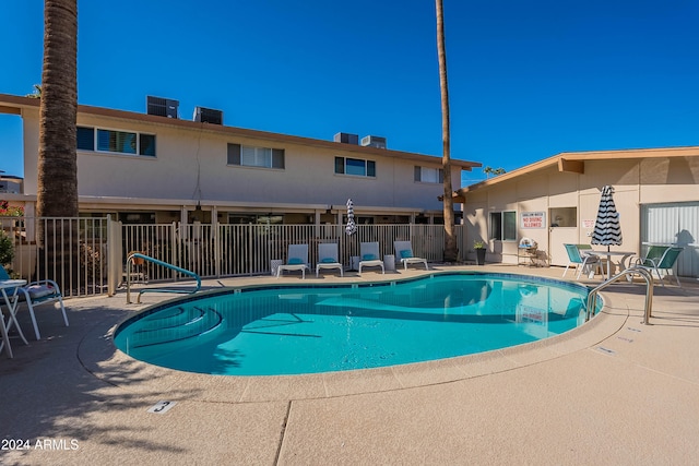 view of swimming pool featuring a patio area