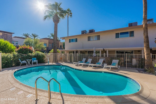 view of swimming pool with a patio area