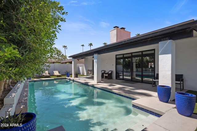 view of swimming pool with a patio area