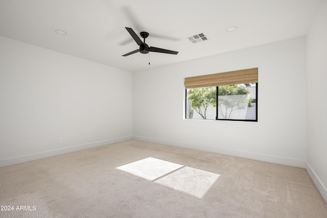 carpeted empty room with ceiling fan