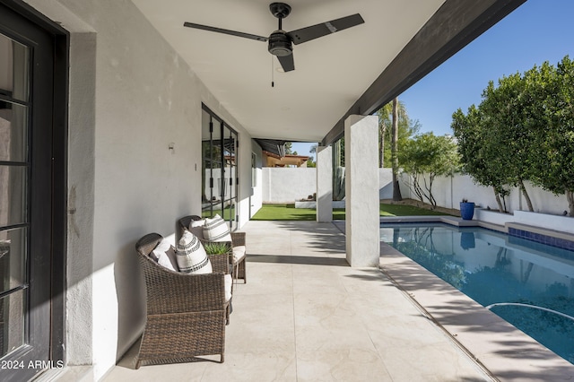 view of pool featuring a patio area and ceiling fan