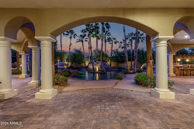 view of patio terrace at dusk