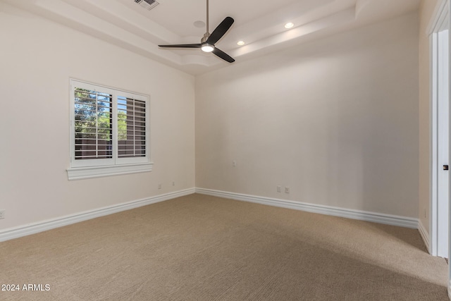 carpeted empty room with ceiling fan