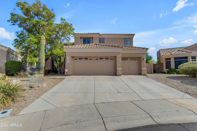 mediterranean / spanish-style house featuring a garage