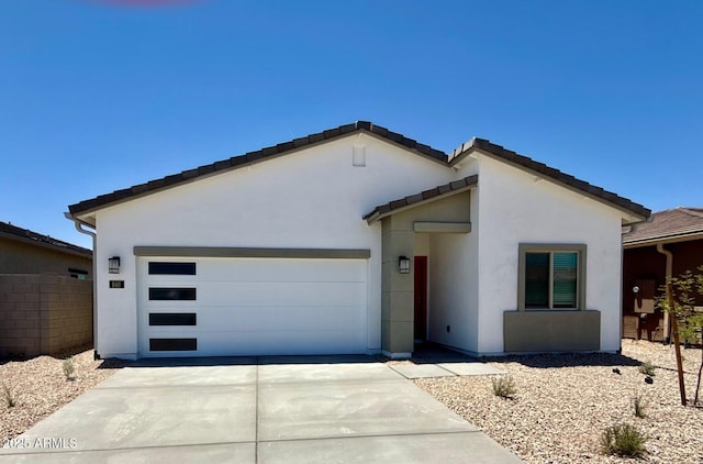 640 S Maricopa Rd, Florence, AZ 85132 - view of front of property with stucco siding, concrete driveway, and a garage