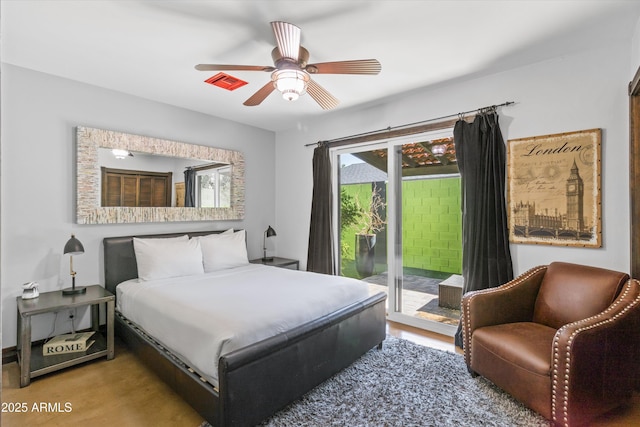 bedroom featuring ceiling fan and access to outside