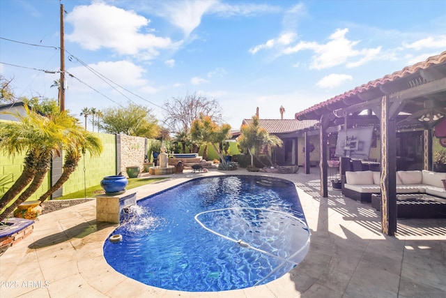 view of pool with a patio, pool water feature, and an outdoor hangout area