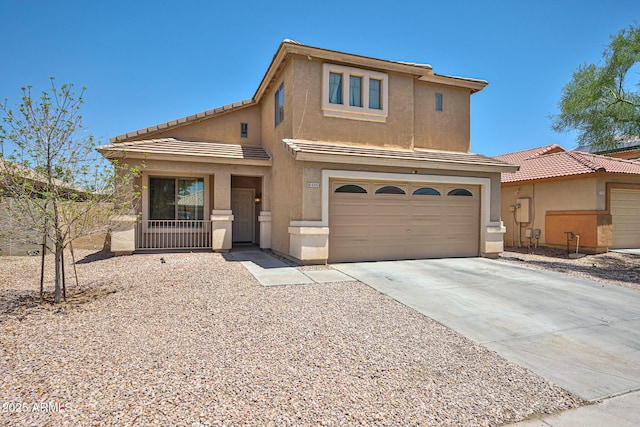 4318 W Apollo Rd, Laveen, AZ 85339 - view of front facade with stucco siding, driveway, a tiled roof, and a garage
