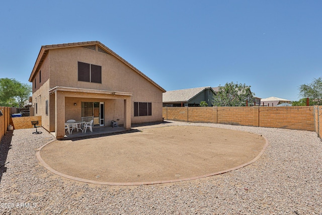 4318 W Apollo Rd, Laveen, AZ 85339 - back of house with a patio area, a fenced backyard, and stucco siding