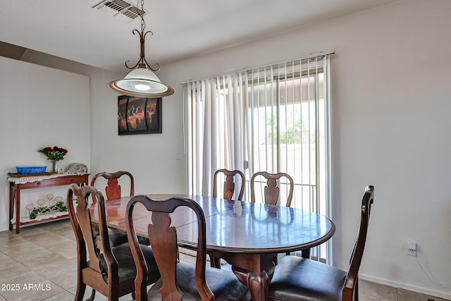 4318 W Apollo Rd, Laveen, AZ 85339 - dining room featuring light tile patterned floors and baseboards