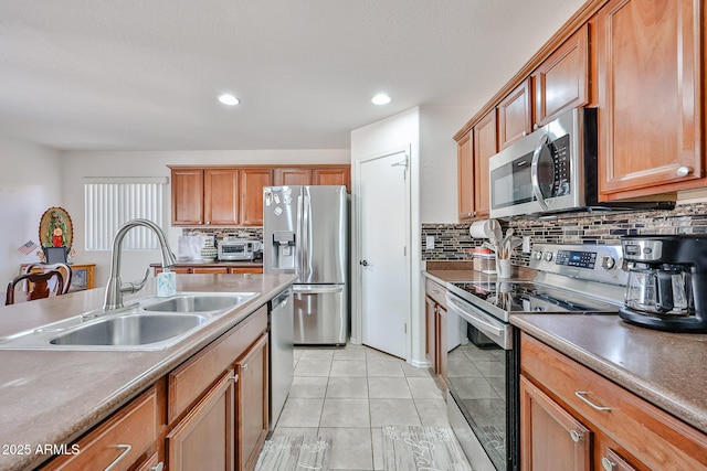 4318 W Apollo Rd, Laveen, AZ 85339 - kitchen with stainless steel appliances, backsplash, light tile patterned floors, recessed lighting, and brown cabinetry