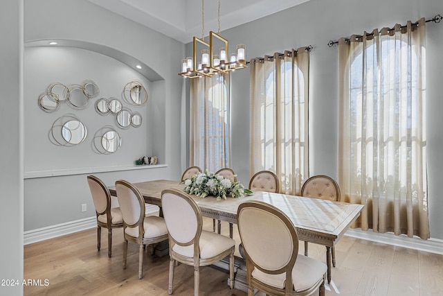 dining room featuring a chandelier and light wood-type flooring