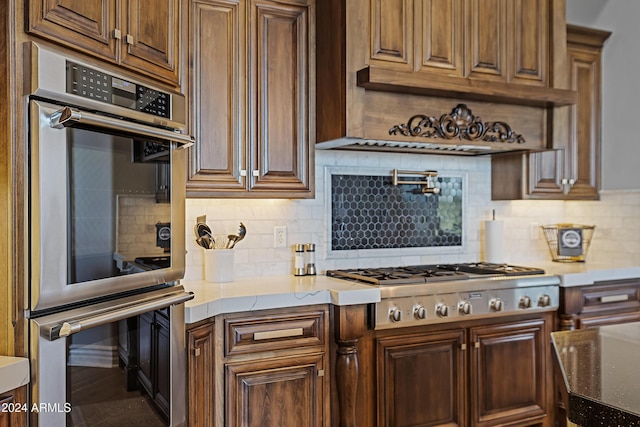 kitchen featuring backsplash and appliances with stainless steel finishes