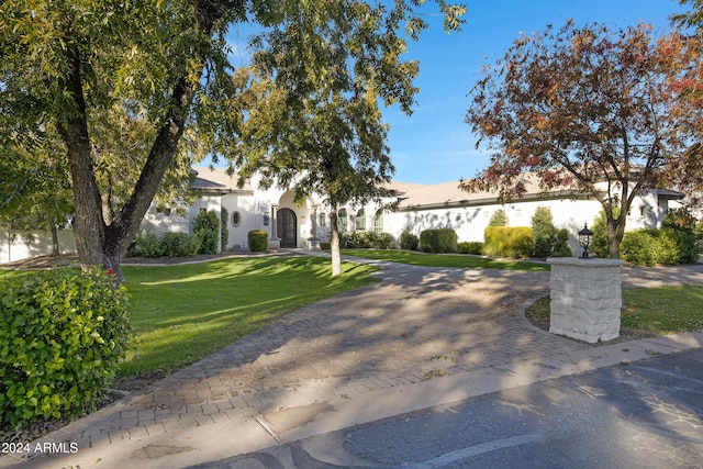 view of front of house with a front lawn