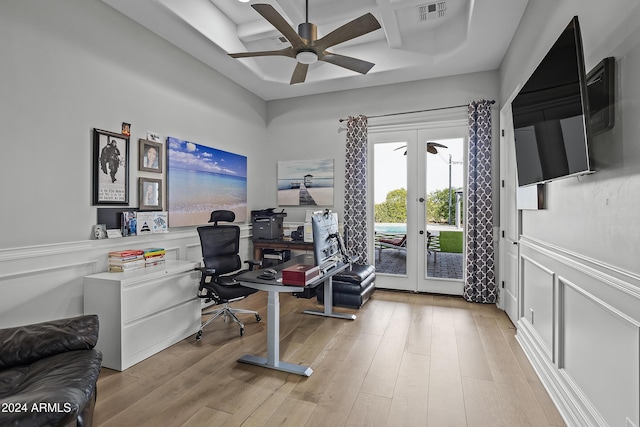 office space featuring coffered ceiling, ceiling fan, light hardwood / wood-style floors, and french doors