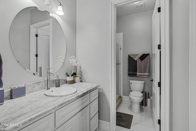 bathroom featuring vanity, toilet, and walk in shower