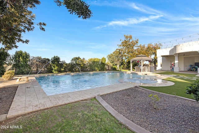 view of swimming pool with a gazebo, pool water feature, and a patio