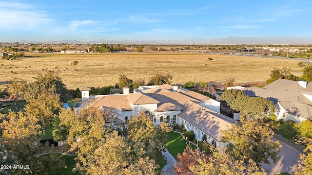 birds eye view of property featuring a mountain view and a rural view