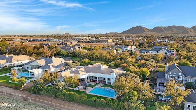 birds eye view of property with a mountain view