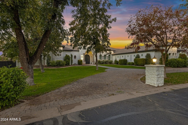 view of front of house with a lawn