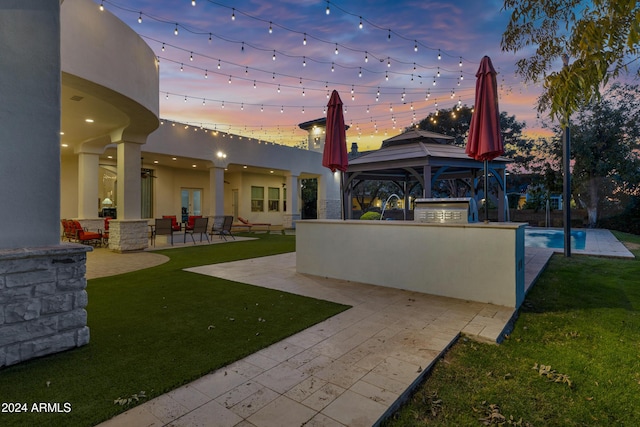 exterior space with a gazebo, area for grilling, a patio area, and a lawn